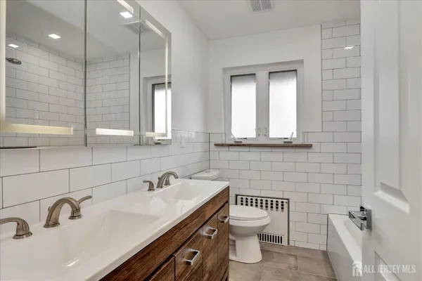 a bathroom with a sink and a toilet