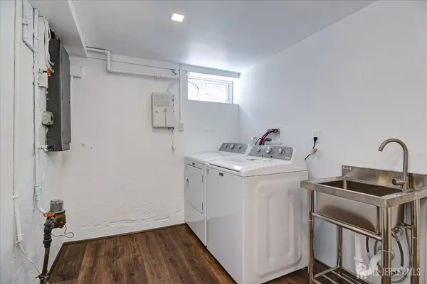a bathroom with a toilet a sink and shower