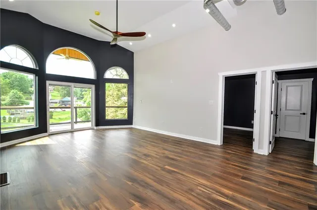 a view of kitchen and hall with wooden floor
