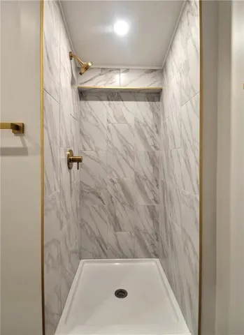 a bathroom with a toilet a sink a vanity and mirror