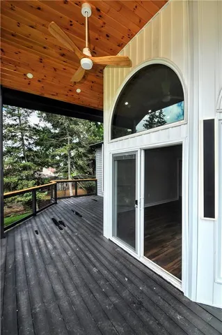 a view of front door and porch with wooden floor