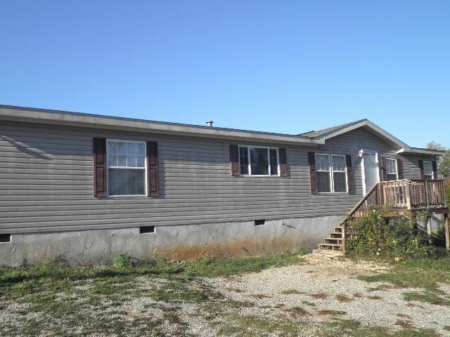 765 Ethridge Road Haddock, GA 31033 - Photo 1 of 1 a front view of a house with a yard