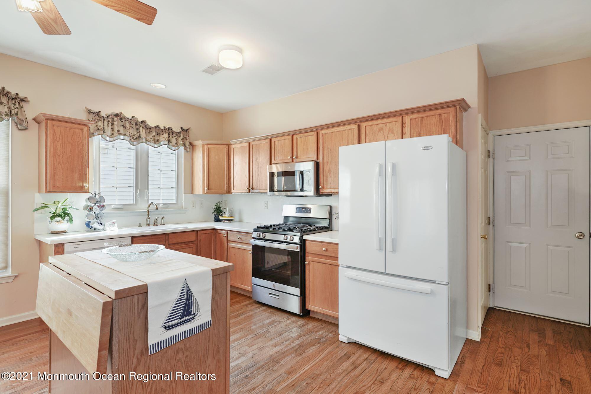 81 Byron Road Brick, NJ 08724 - Photo 16 of 51 a kitchen with a stove a sink and a refrigerator
