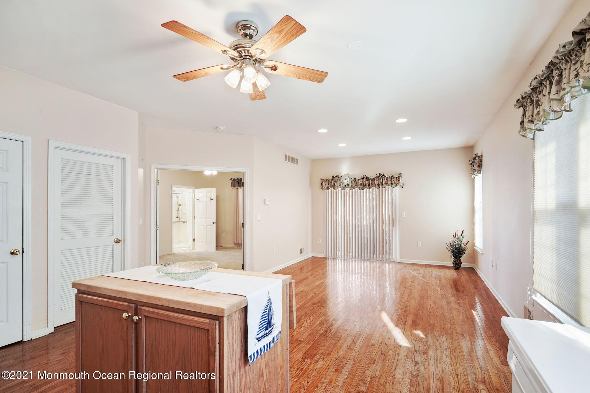 81 Byron Road Brick, NJ 08724 - Photo 18 of 51 a living room with kitchen island a sink and a refrigerator