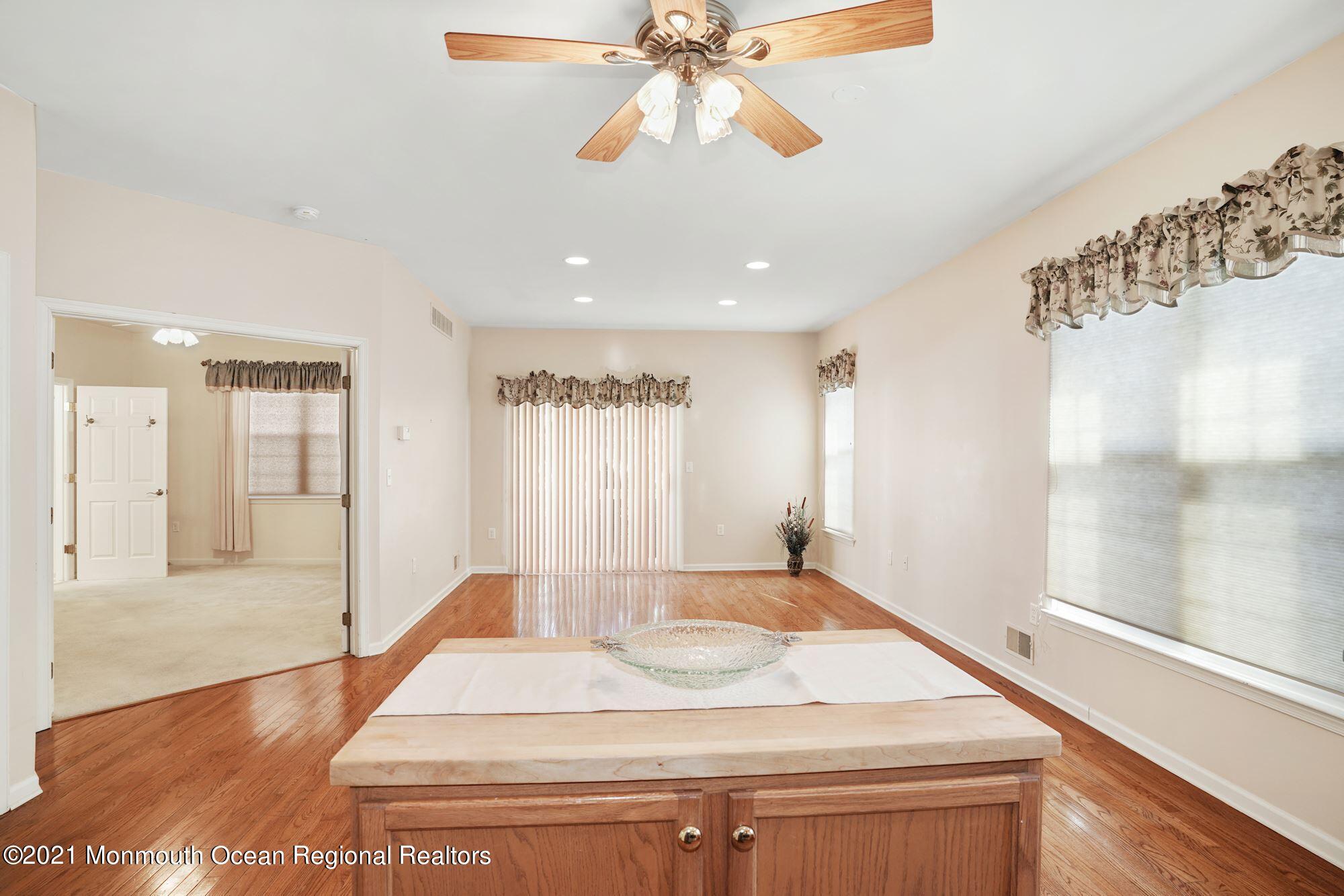 81 Byron Road Brick, NJ 08724 - Photo 23 of 51 a room with a bed and a chandelier