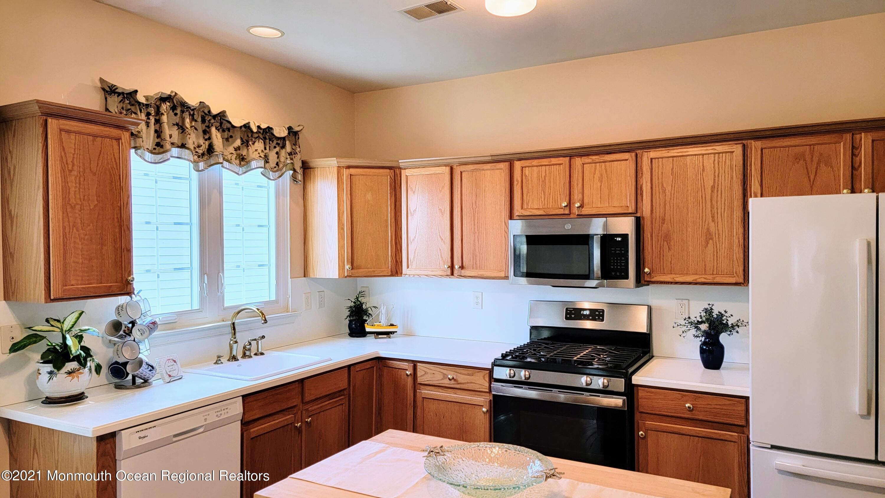 81 Byron Road Brick, NJ 08724 - Photo 24 of 51 a kitchen with a sink stove and microwave