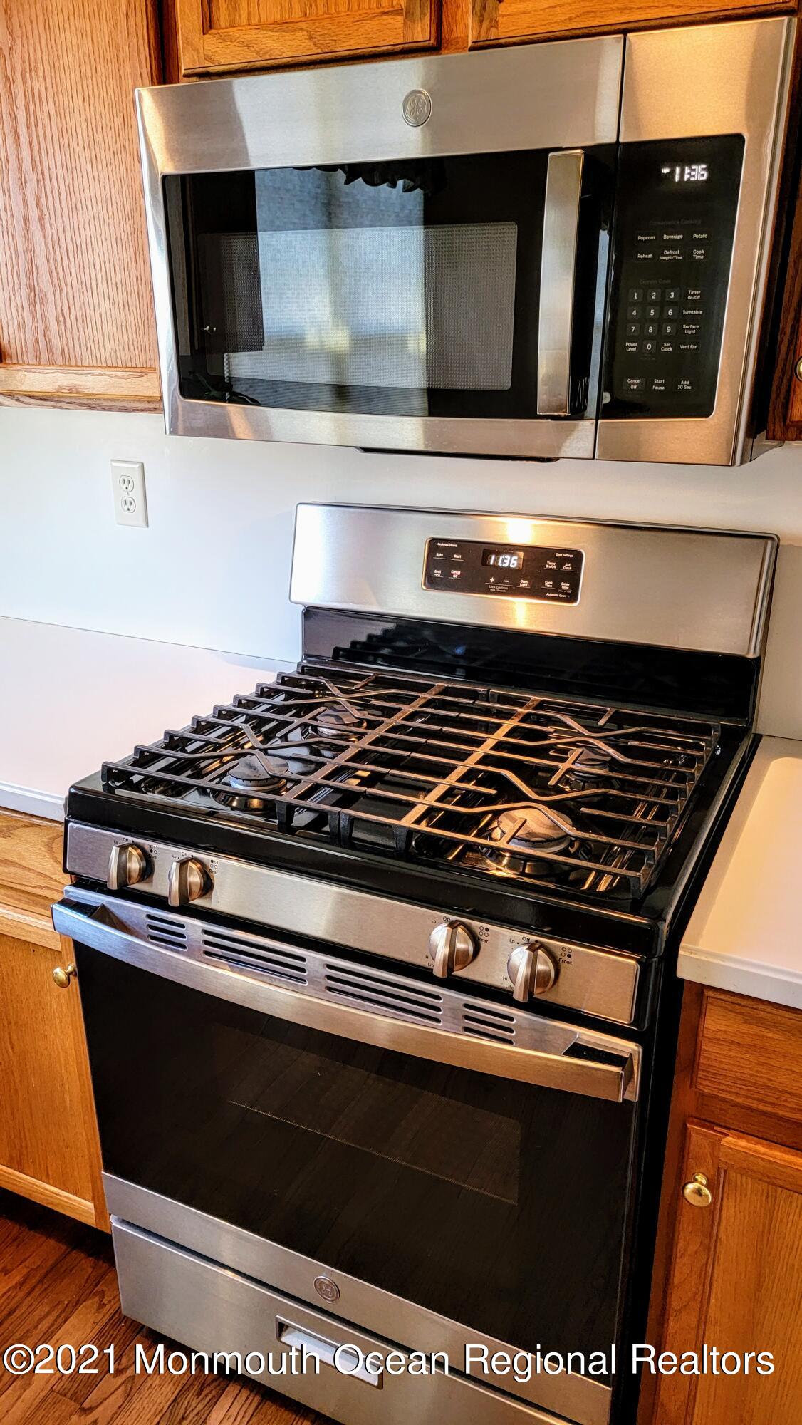 81 Byron Road Brick, NJ 08724 - Photo 25 of 51 a stove top oven sitting inside of a kitchen