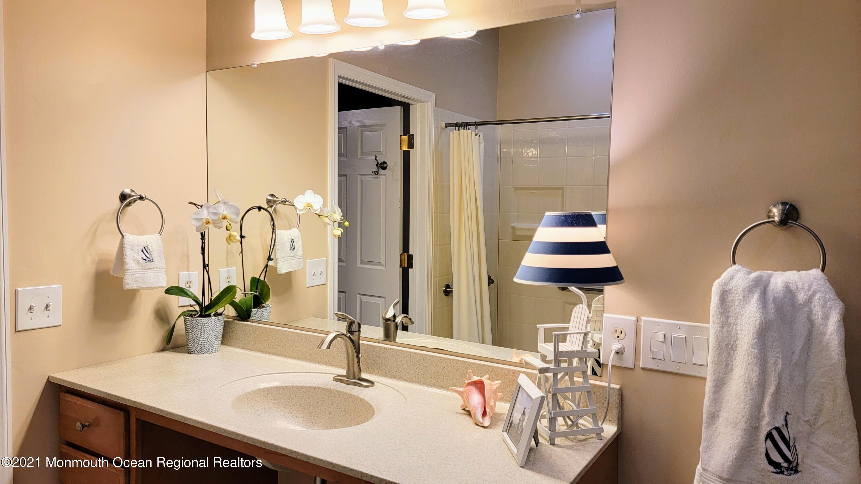 81 Byron Road Brick, NJ 08724 - Photo 31 of 51 a bathroom with double vanity sinks and a mirror