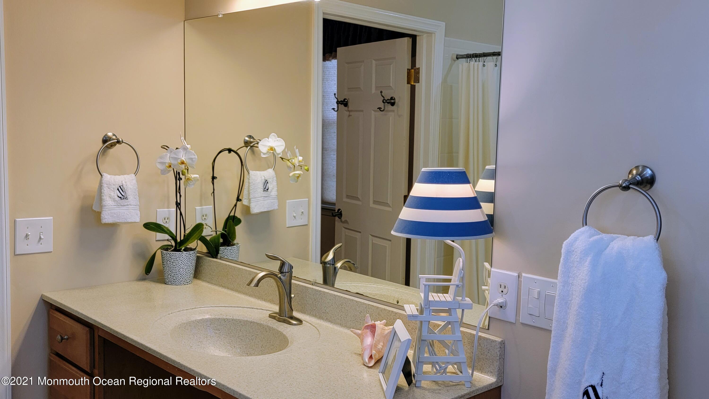 81 Byron Road Brick, NJ 08724 - Photo 33 of 51 a bathroom with a double vanity sink and a mirror