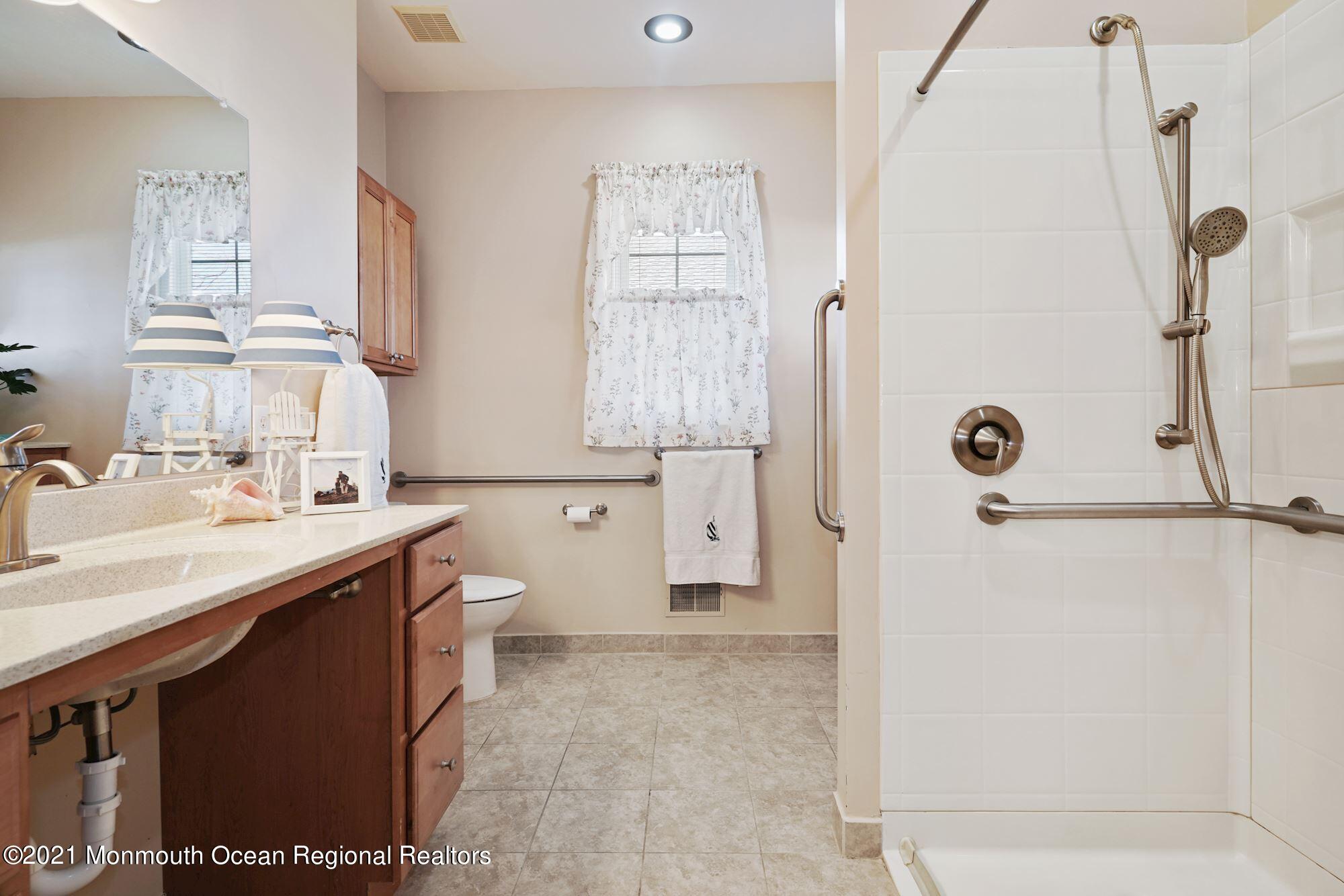 81 Byron Road Brick, NJ 08724 - Photo 34 of 51 a bathroom with a granite countertop sink a mirror and a shower
