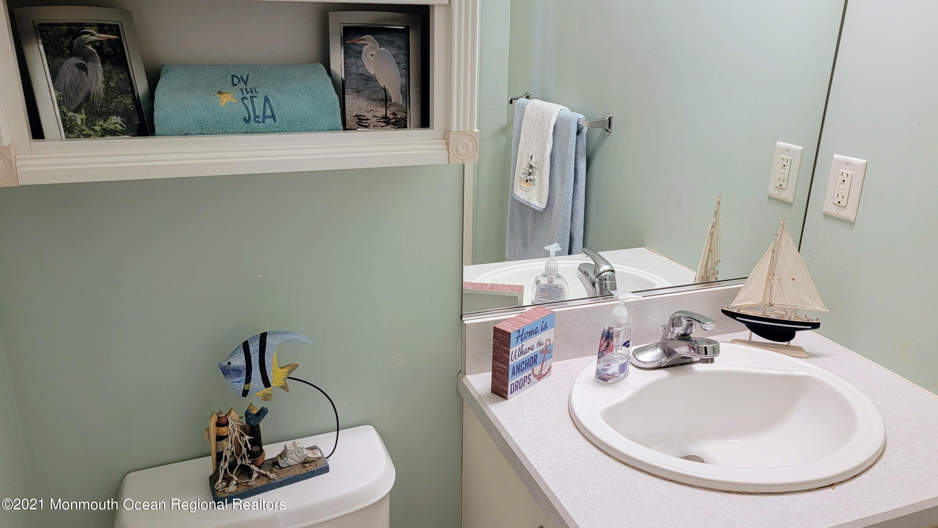 81 Byron Road Brick, NJ 08724 - Photo 39 of 51 a bathroom with a sink and a mirror