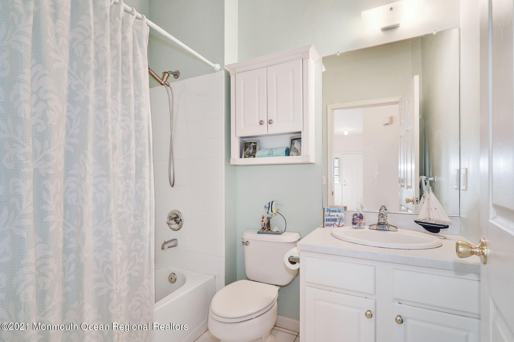 81 Byron Road Brick, NJ 08724 - Photo 40 of 51 a bathroom with a sink a toilet and shower