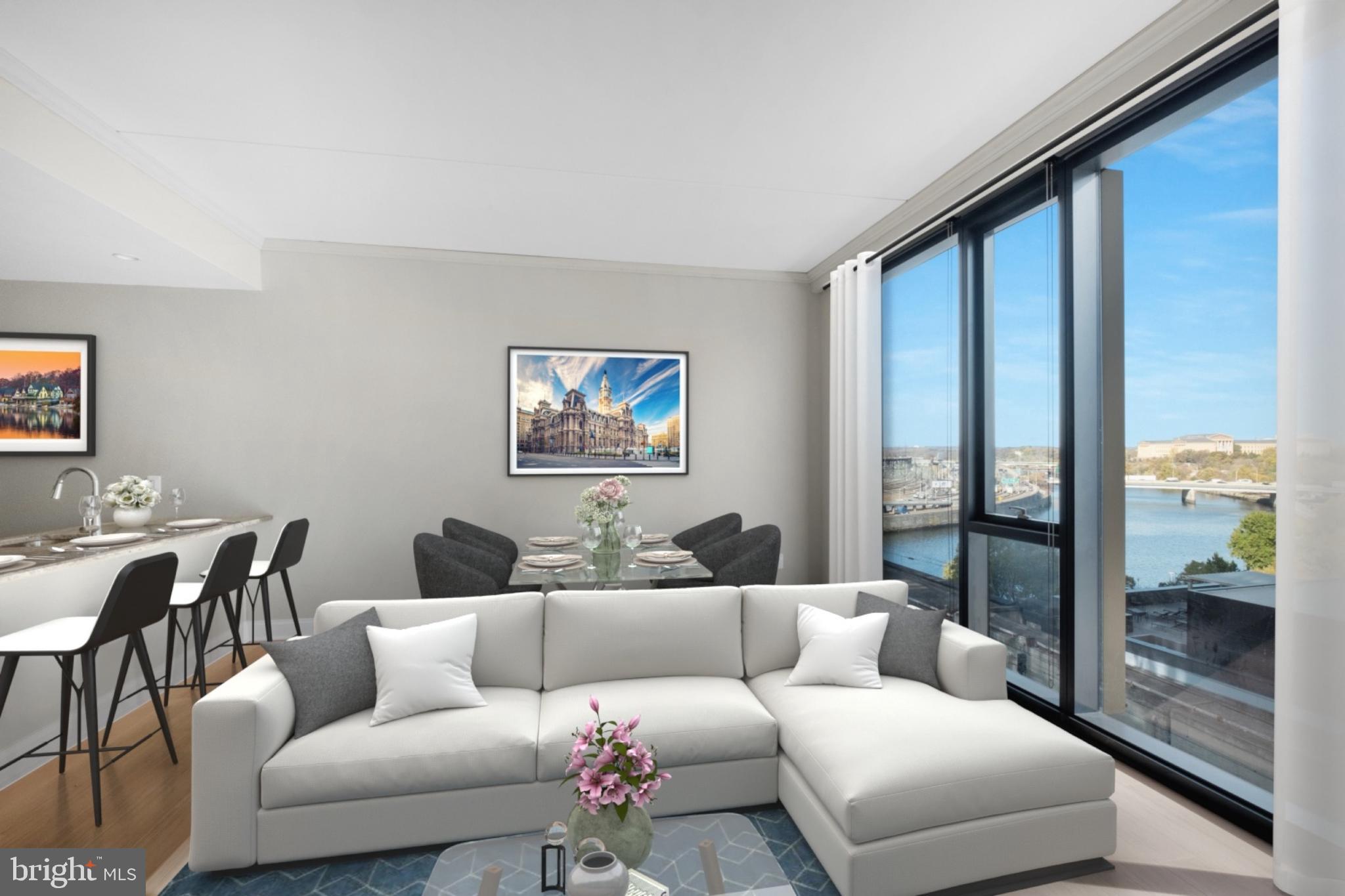 2301-61 John F Kennedy Boulevard, Unit 1001 Philadelphia, PA 19103 - Photo 3 of 39 a living room with furniture and a floor to ceiling window