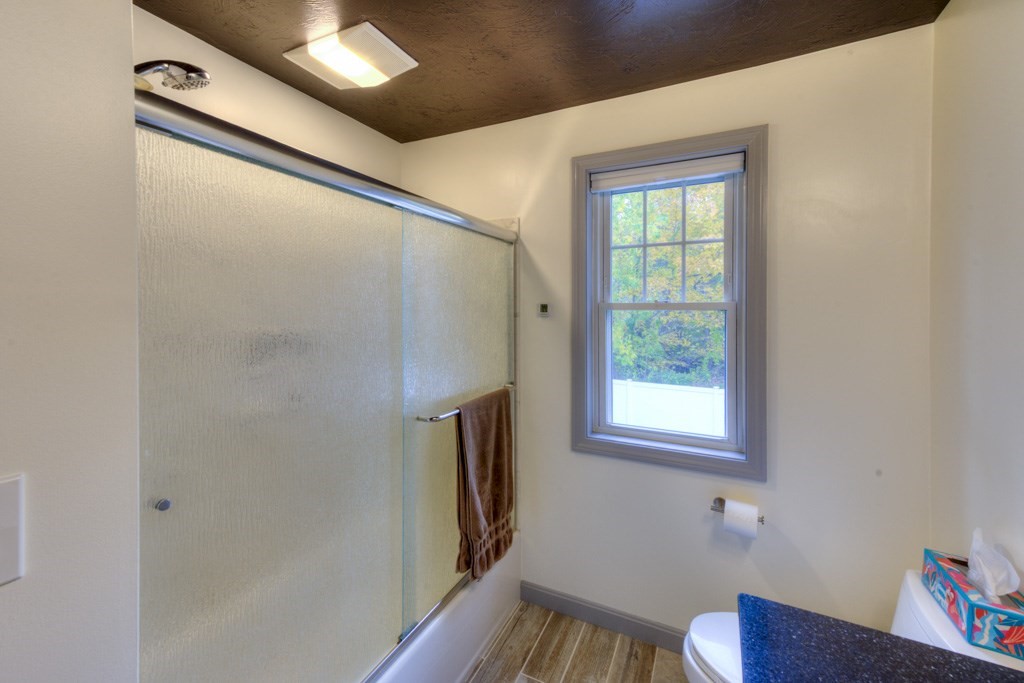20 Alpine Trail Auburn, MA 01501 - Photo 16 of 40 a bathroom with a window and a shower