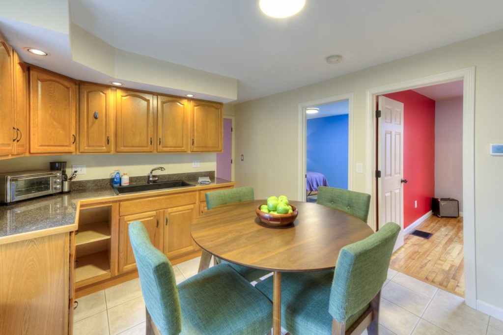 20 Alpine Trail Auburn, MA 01501 - Photo 20 of 40 a kitchen with a table chairs and window