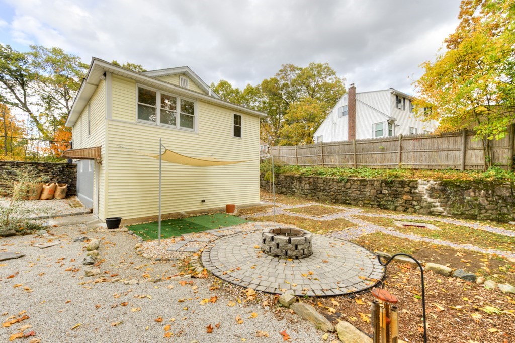 20 Alpine Trail Auburn, MA 01501 - Photo 37 of 40 a backyard of a house with a table and chairs