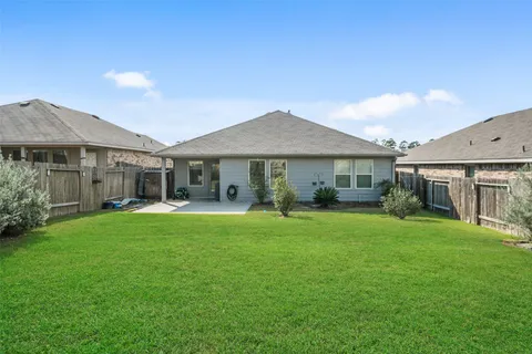 a front view of a house with a garden and porch