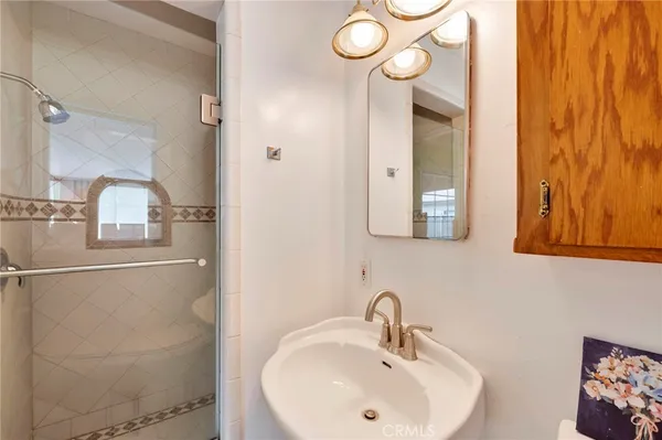 a bathroom with a sink and mirror