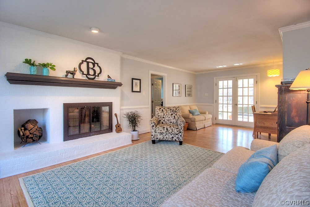 3121 East Brigstock Road Midlothian, VA 23113 - Photo 17 of 39 a living room with furniture and a fireplace