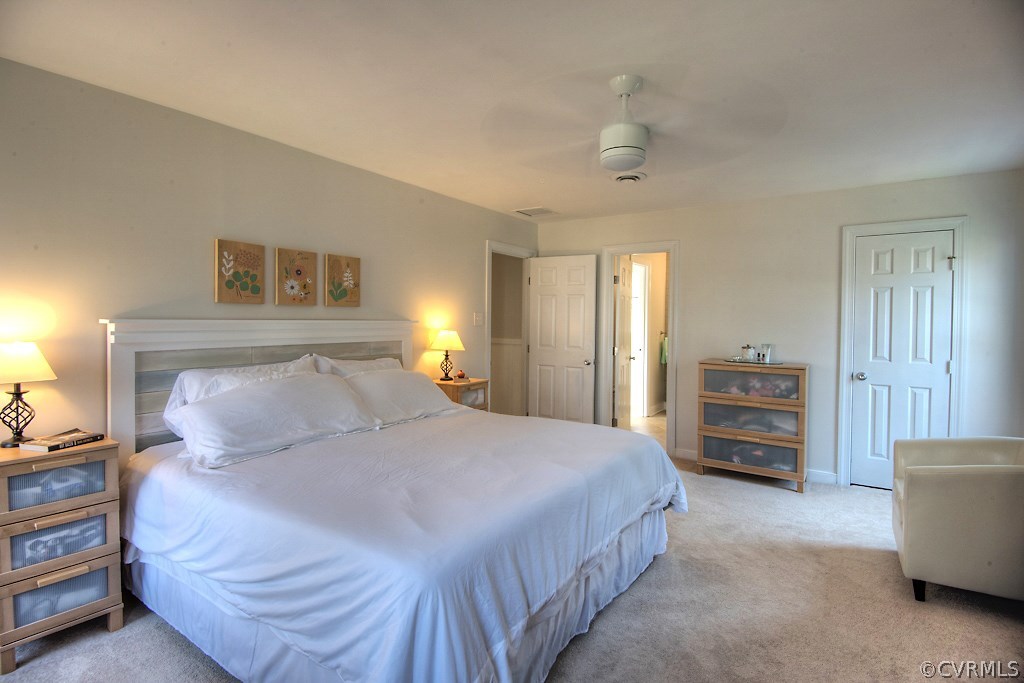 3121 East Brigstock Road Midlothian, VA 23113 - Photo 22 of 39 a bedroom with a bed and a couch