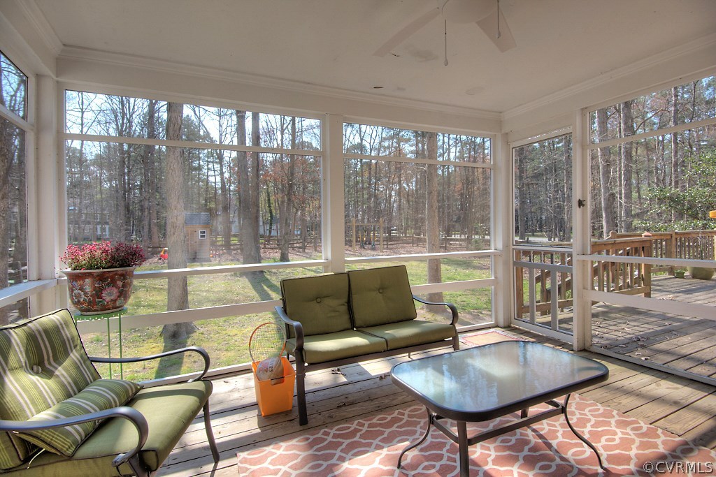 3121 East Brigstock Road Midlothian, VA 23113 - Photo 31 of 39 a living room with furniture and a floor to ceiling window