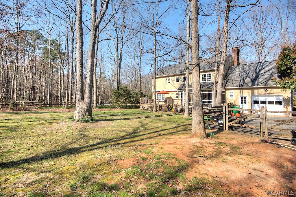 3121 East Brigstock Road Midlothian, VA 23113 - Photo 37 of 39 a view of a house with a backyard and a tree