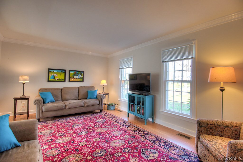 3121 East Brigstock Road Midlothian, VA 23113 - Photo 4 of 39 a living room with furniture and a flat screen tv