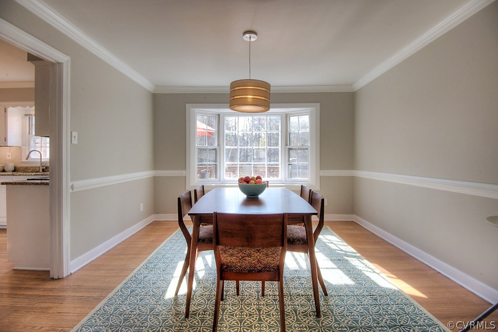 3121 East Brigstock Road Midlothian, VA 23113 - Photo 6 of 39 a view of a dining room with a table and chairs