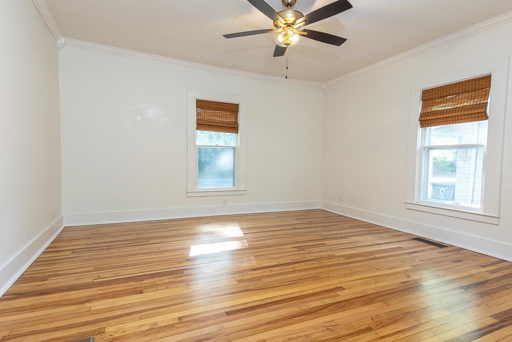 119 South Fenwick Road Memphis, TN 38111 - Photo 22 of 28 a view of an empty room with wooden floor and a window