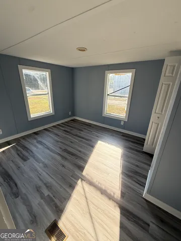 a view of an empty room and window