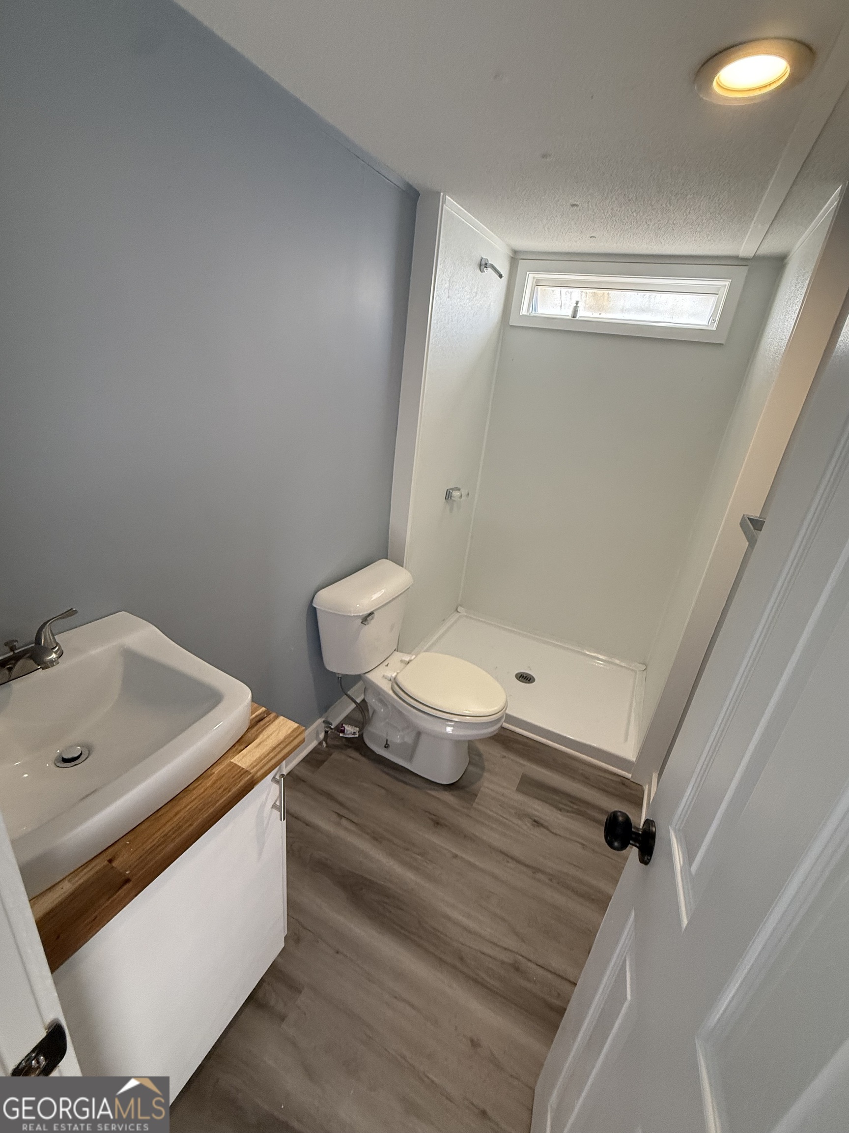 8410 Hawkinsville Road Macon, GA 31216 - Photo 13 of 22 a bathroom with a toilet sink and mirror