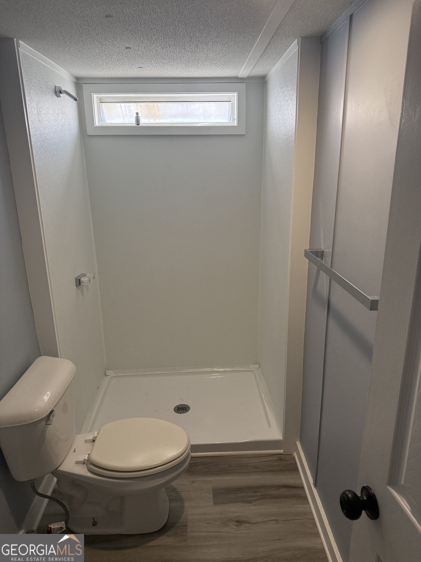 8410 Hawkinsville Road Macon, GA 31216 - Photo 14 of 22 a bathroom with a toilet and a shower