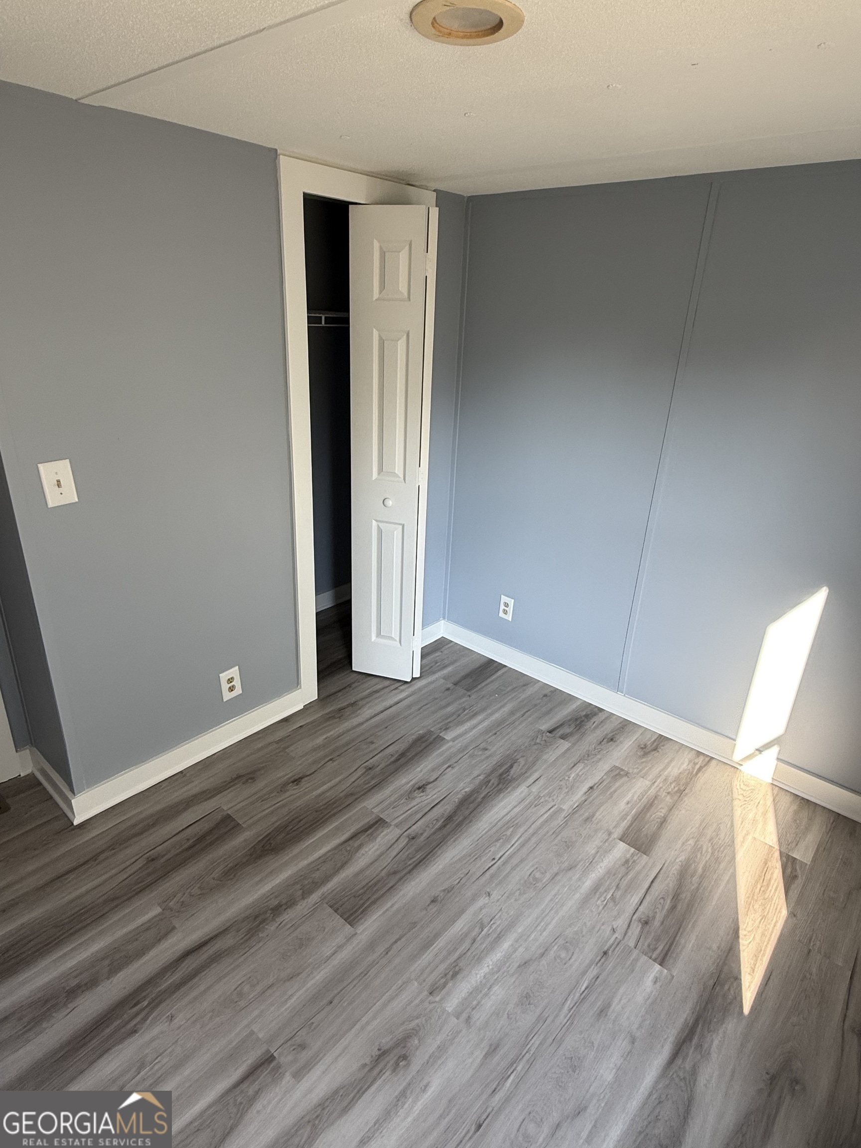 8410 Hawkinsville Road Macon, GA 31216 - Photo 15 of 22 wooden floor in an empty room