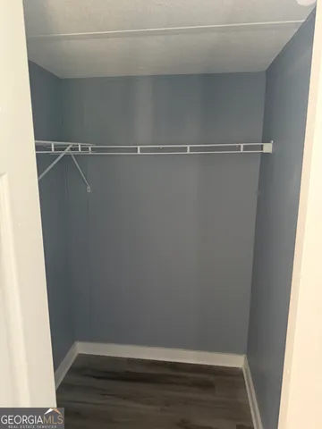 a view of an empty walk in closet
