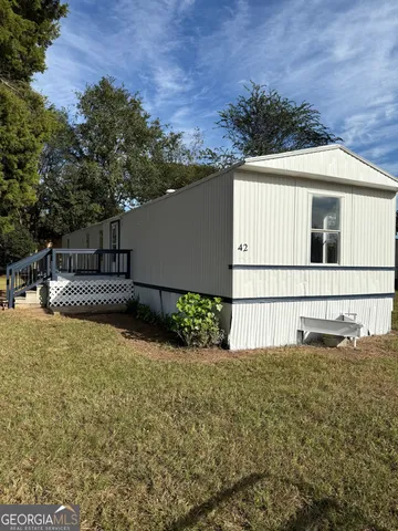 a house with trees in the background