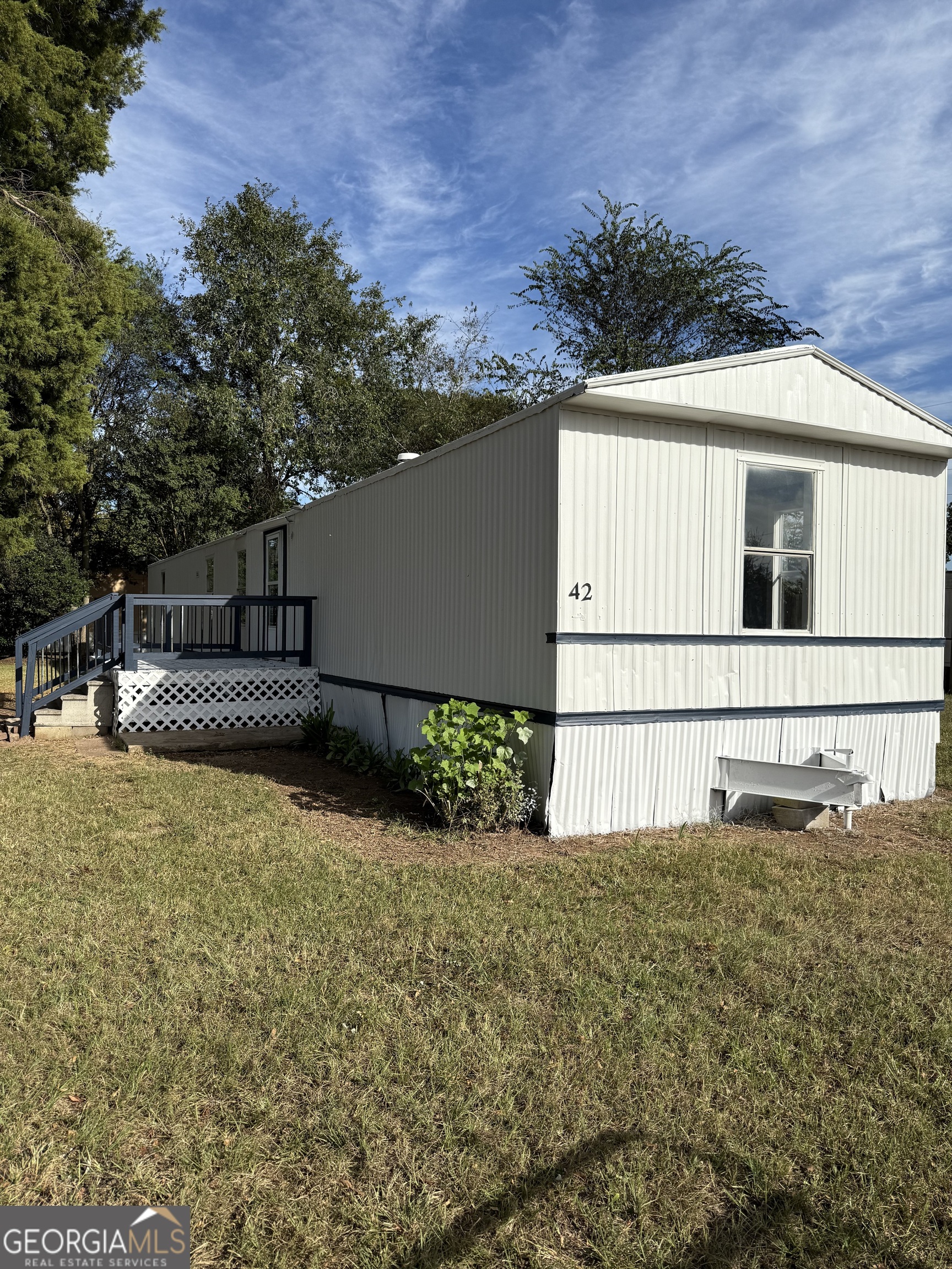 8410 Hawkinsville Road Macon, GA 31216 - Photo 3 of 22 a house with trees in the background