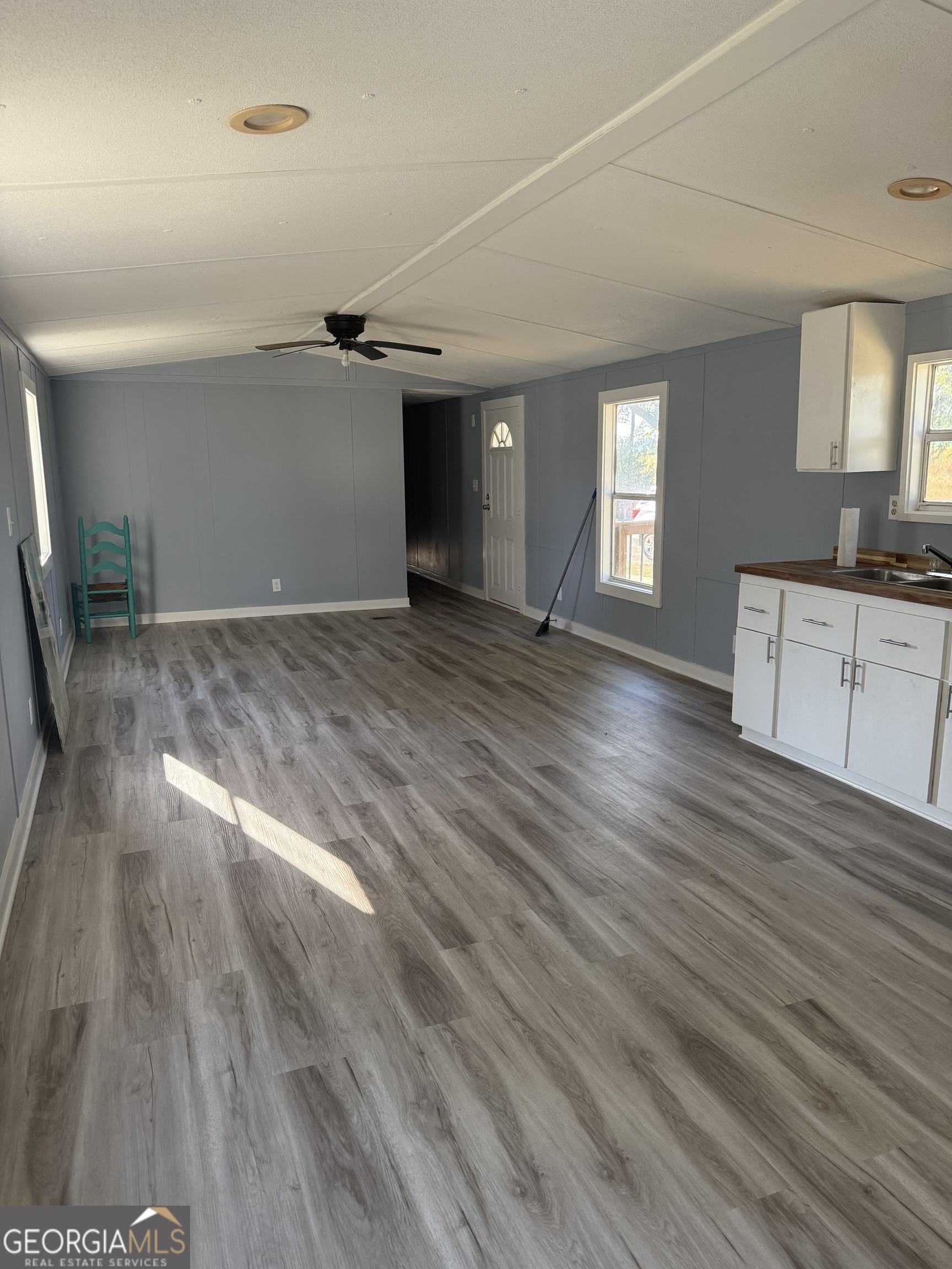 8410 Hawkinsville Road Macon, GA 31216 - Photo 9 of 22 a view of empty room with wooden floor