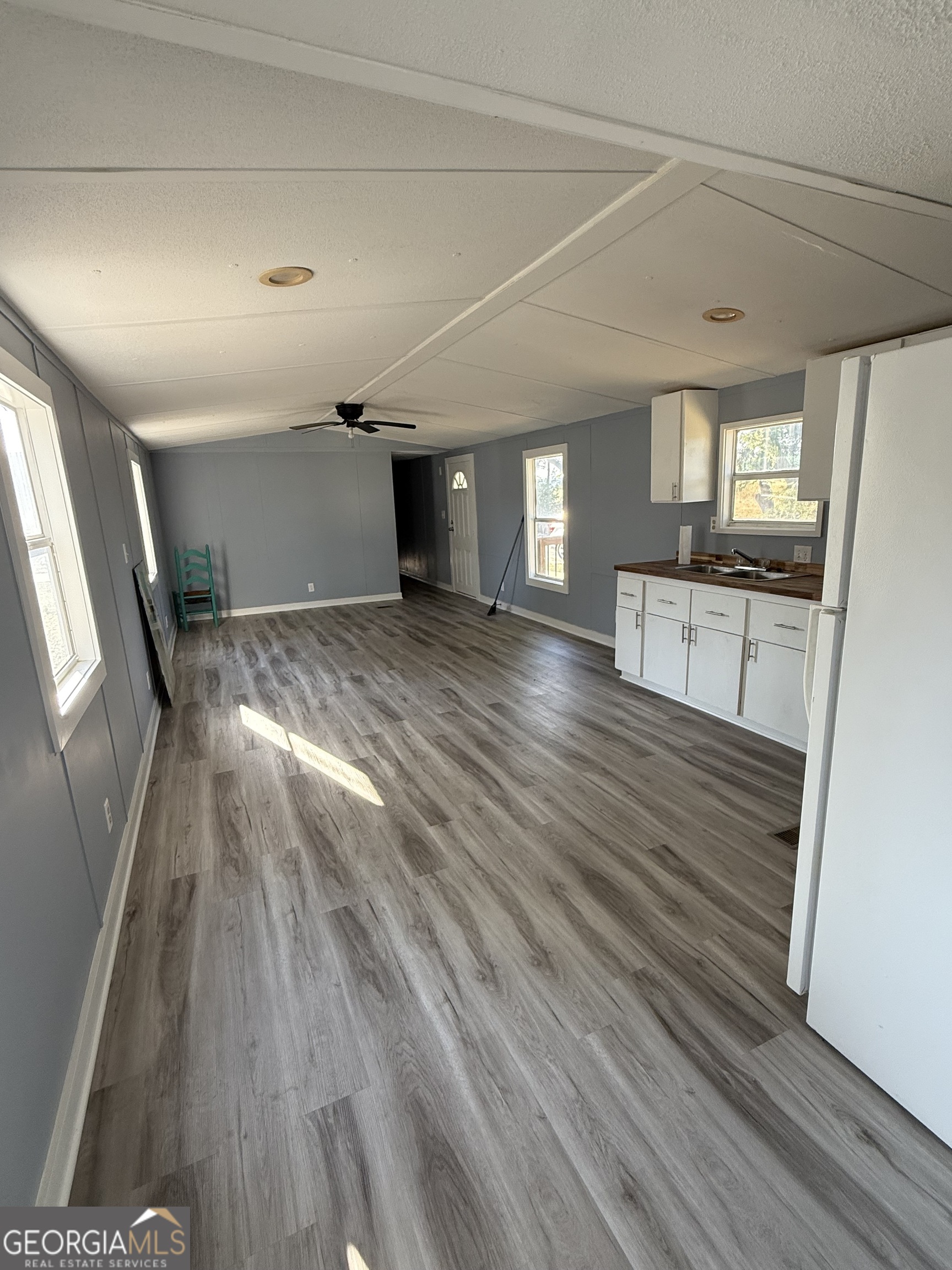 8410 Hawkinsville Road Macon, GA 31216 - Photo 10 of 22 a view of a room with wooden floor and staircase