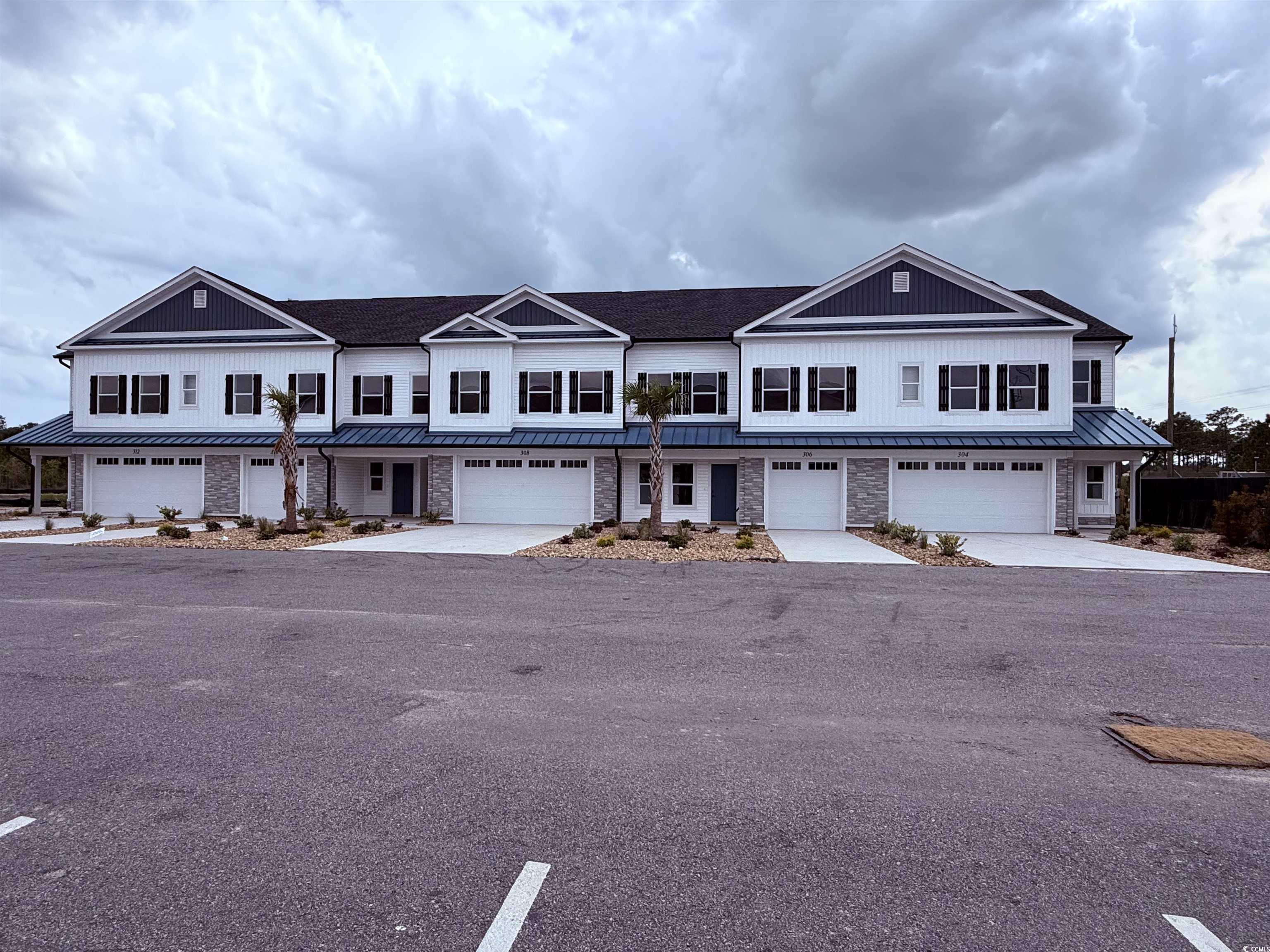 Multi unit property with a garage, a standing seam