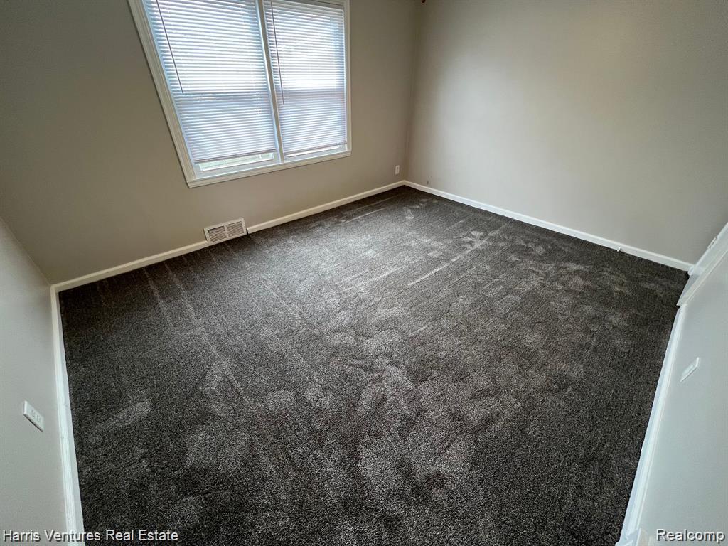21534 Moross Road Grosse Pointe, MI 48236 - Photo 11 of 16 Bedroom #2 with carpeted flooring and light gray walls