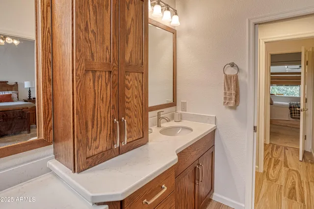a bathroom with a sink and mirror