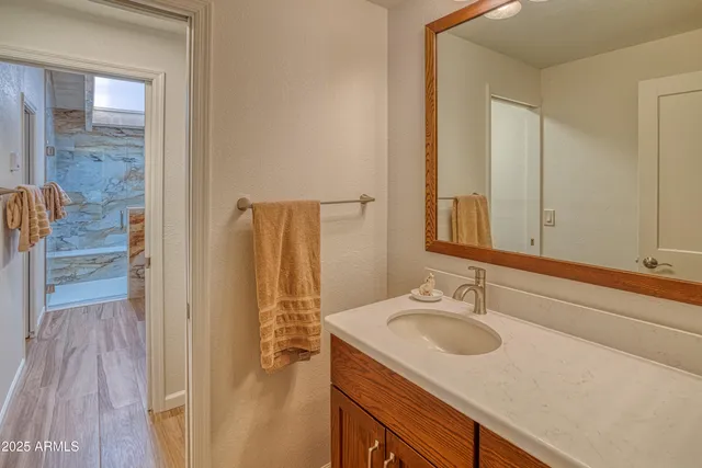 a bathroom with a sink and a mirror