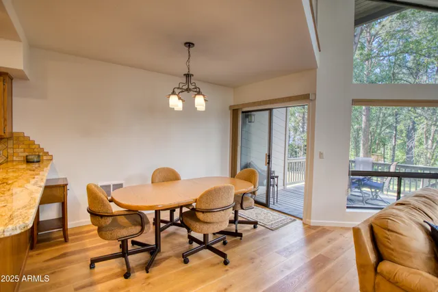 a view of a livingroom with furniture window and wooden floor