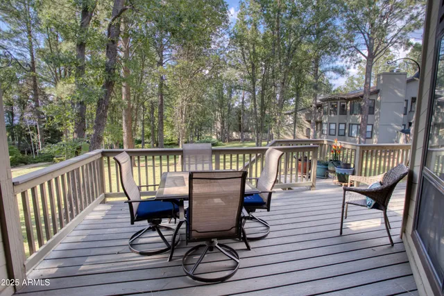 a view of a deck with furniture