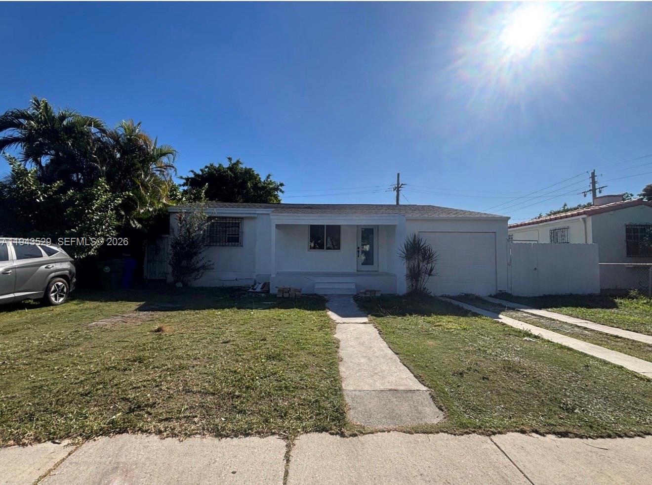 4380 Southwest 1st Street, Unit 1 Miami, FL 33134 - Photo 1 of 10 a front view of a house with garden