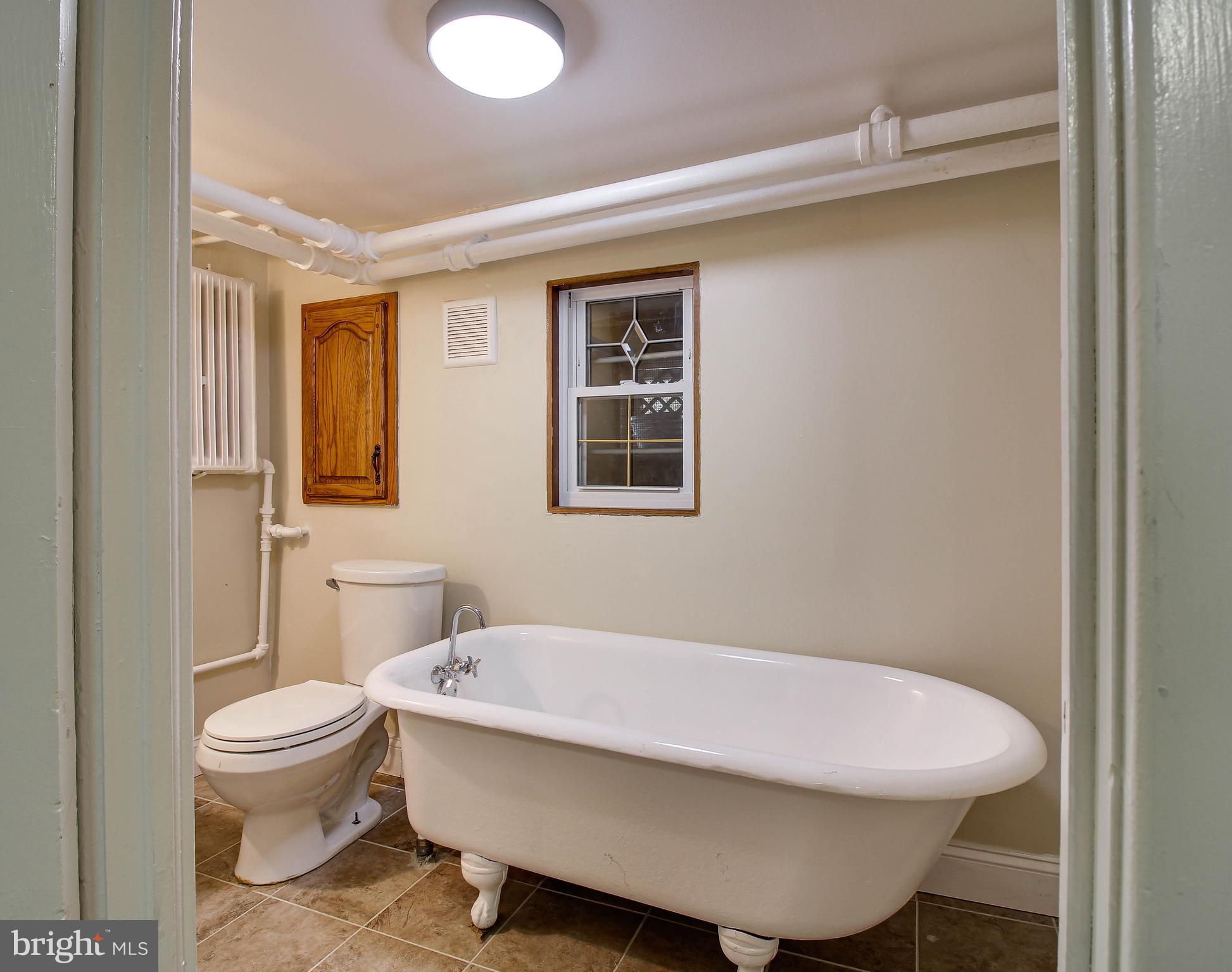 211 Mallow Hill Road Baltimore, MD 21229 - Photo 35 of 49 a bathroom with a sink toilet and shower