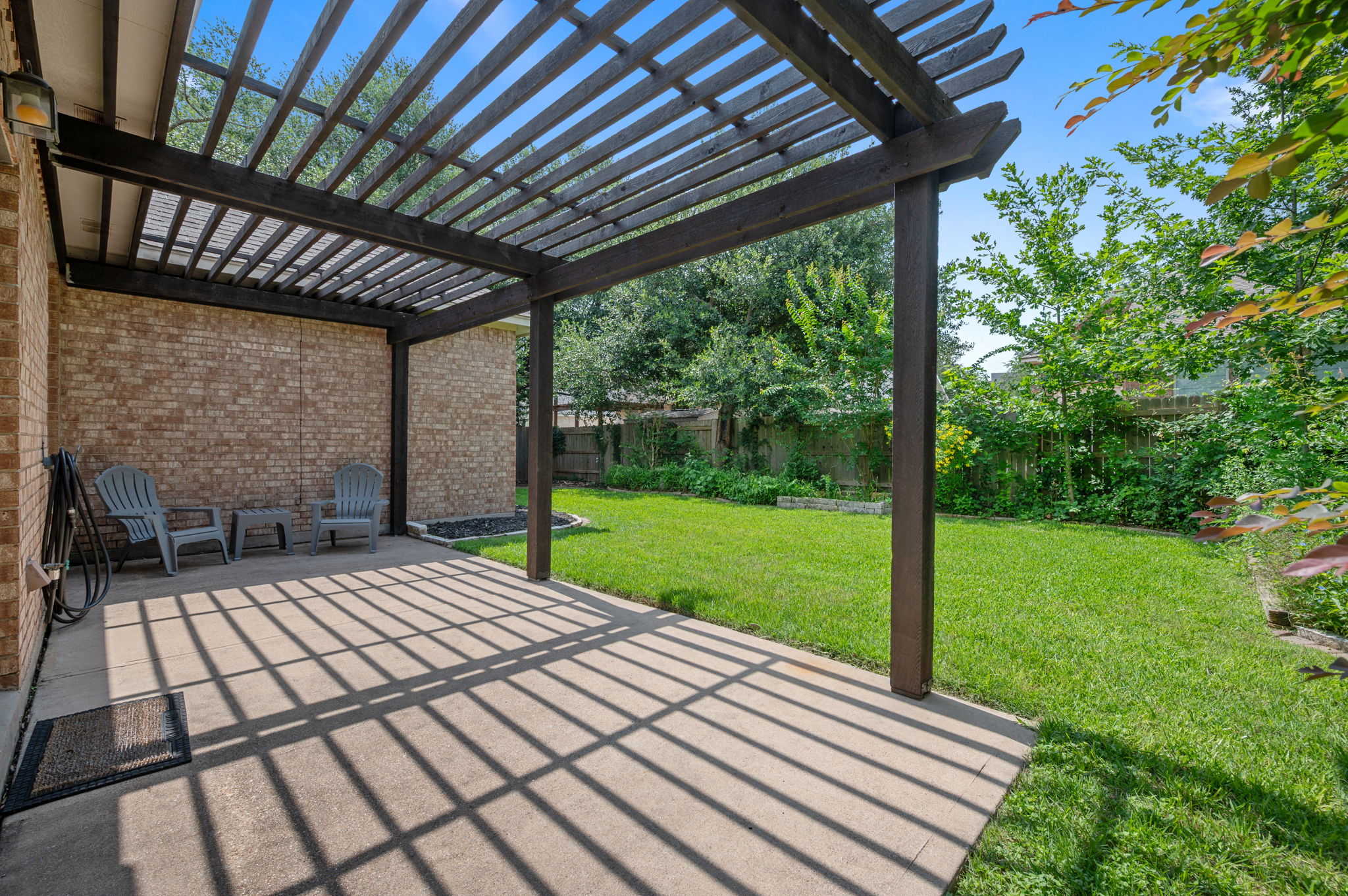 9201 La Siesta Bend Austin, TX 78749 - Photo 32 of 37 a view of a backyard with wooden floor barbeque oven and a backyard