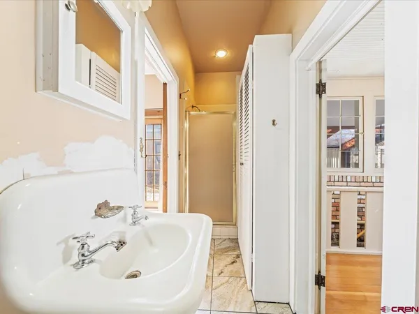 a bathroom with a sink and a mirror