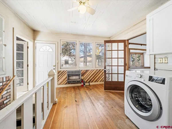 a bedroom with furniture and a fireplace