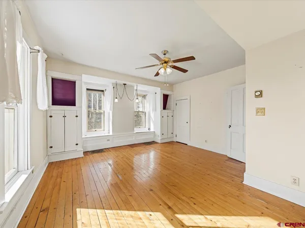 a view of front door and wooden floor